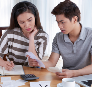 Young couple doing their monthly budget planning